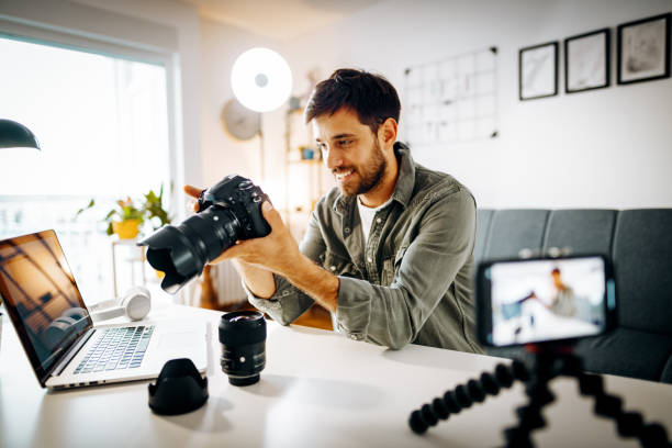 istock Photographer - influencer vlogging from home with newest camera 1287635337