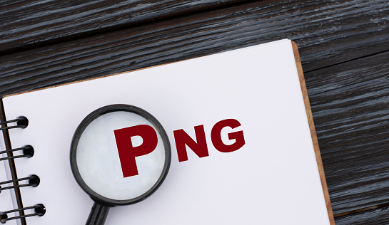 PNG (Portable Network Graphics) - word written in a notebook on a dark beautiful background with a magnifying glass. Internet concept