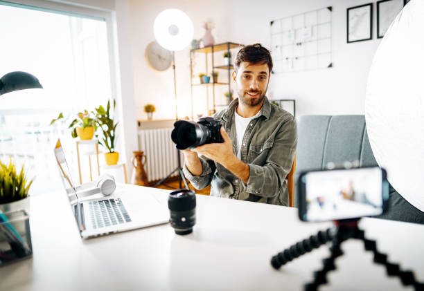istock Photographer - influencer vlogging from home with newest camera 1287635488