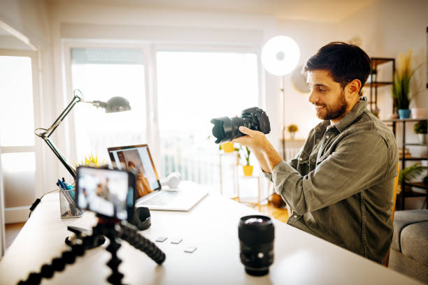 istock Photographer - influencer vlogging from home with newest camera 1287635551