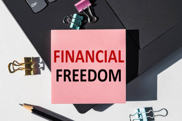 istock Financial Freedom note is written on a paper sticker on a laptop keyboard 1287635692