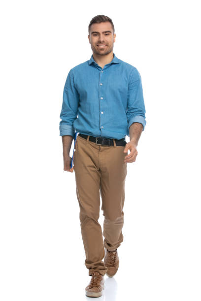 istock handsome casual man walking towards the camera 1287638622