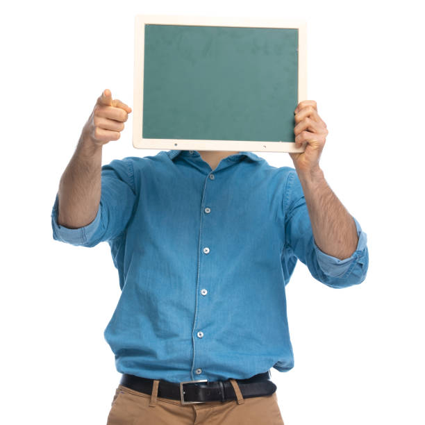 istock casual man pointing at the camera and hiding 1287638637