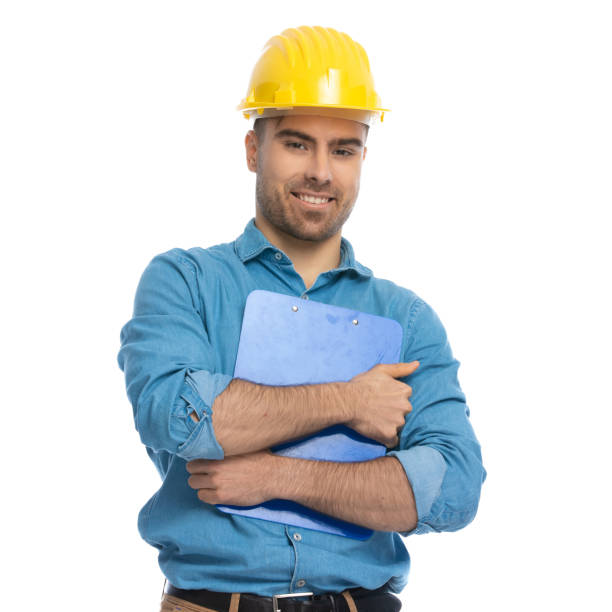 istock young casual man holding his clipboard tight at chest 1287638738