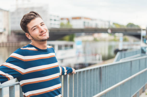 istock Relaxed peacefully young man in the city 1287638939