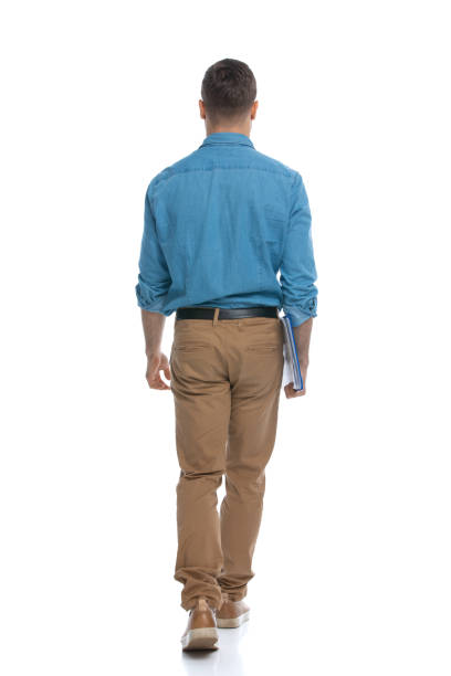 istock handsome casual man walking away from the camera 1287638961