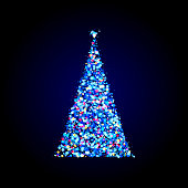 istock Magical illuminated Christmas tree made from dreamy lights on dark background. Magic fairy dust, sparkle stardust. 1287639892