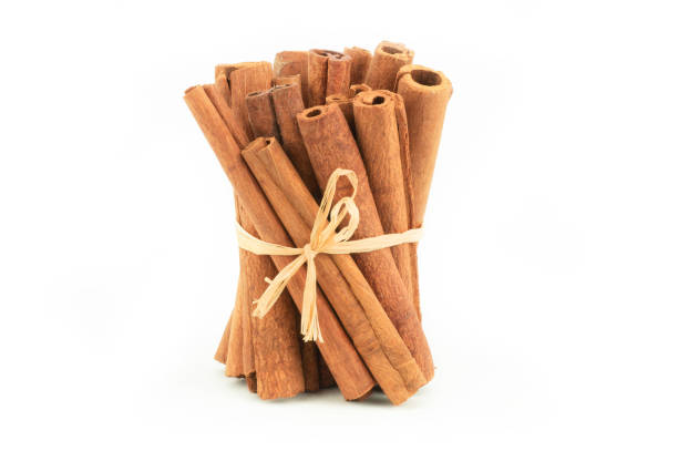 istock Cinnamon sticks isolated on white background, healthy spice, (Cinnamomum) 1287641906