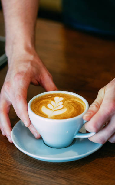 istock Woman Holding a Cup of Coffee 1287642743