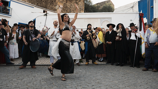 Mértola, Portugal - May 19, 2019: A belly dancer performs at the closure of a folklore festival in the village of Mértola in Alentejo.