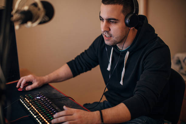 istock Male gamer playing video games on computer 1287642863