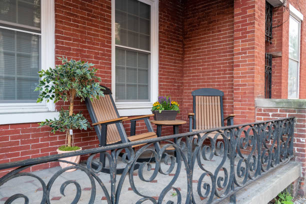 istock Rocking Chairs on Porch with Iron Railing 1287643068