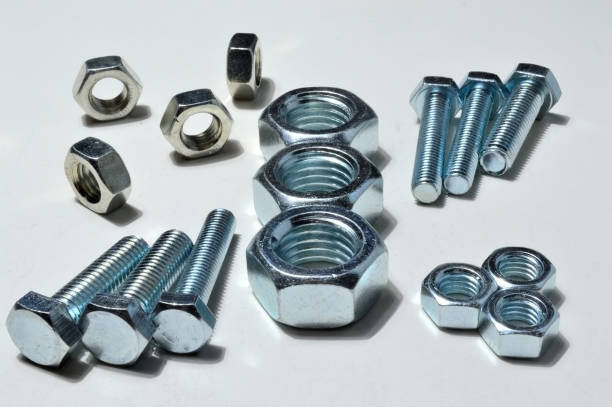 istock Big and small screw-nut. Concept. White background. 1287644466