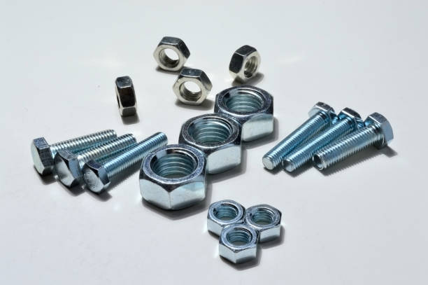 istock Big and small screw-nut. Concept. White background. 1287644499