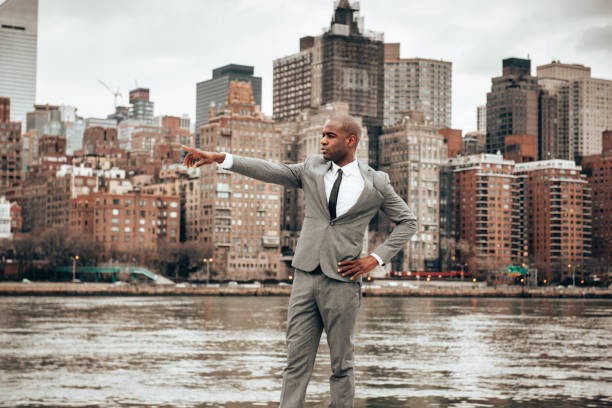 istock man pointing on the manhattan skyline 1287644840