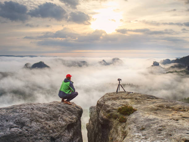 istock Photographer Or Videographer Traveler Thinking Attripod With Digital Camera Prepared For An Art Work 1287645595