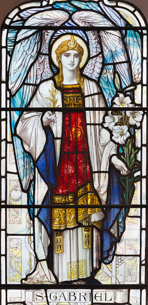 London - The archangel Gabriel on the stained glass in church St. Michael, Chester square.