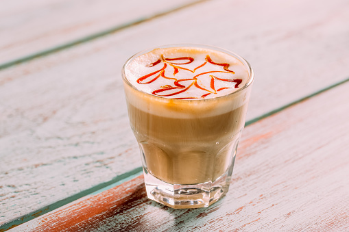 Delicious Caramel Macchiato on a Rustic Background