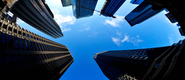 istock Highrise skyscraper buildings in a big city with blue sky metro setting 1287649073