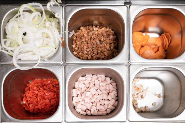 Top view of metal container with pizza ingredients