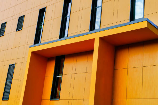 istock Geometry of yellow modern residential building facade 1287650324