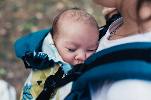 istock Young mother with baby in carrier 1287651522