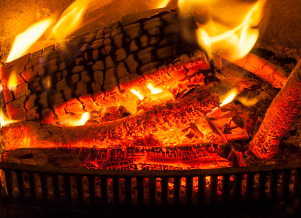 istock Winter with Fire in the Fireplace 1287651575