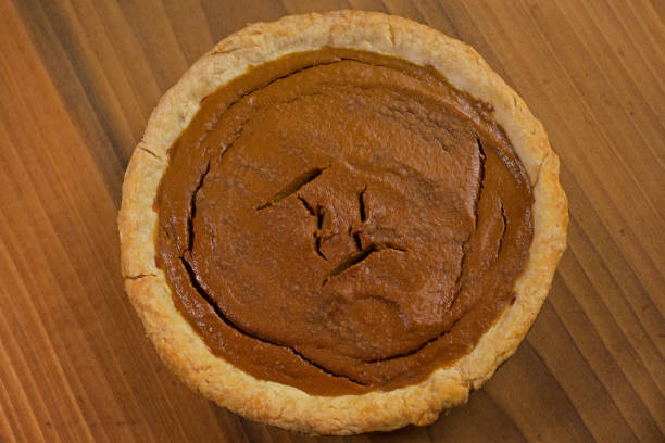 istock Fresh baked pumpkin pie with cinnamon sprinkled on the surface. 1287651610
