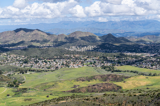 Mountaintop view of nature park meadows and suburban homes in scenic Newbury Park near Los Angeles, California.