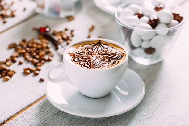 Delicious Coffee Latte on a White Wooden Table