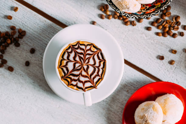 istock Delicious Coffee Latte on a White Wooden Table 1287654265
