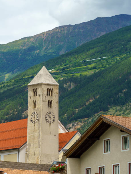 Summer landscape along the cycleway of the Venosta valley and the Adige river, in the Bolzano province, Trentino Alto Adige, Italy. the village of Lasa