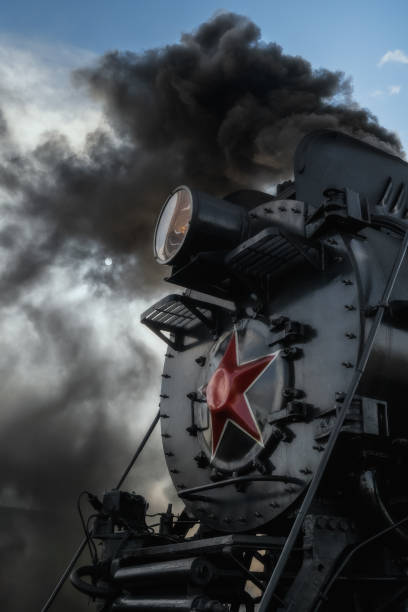 istock Old retro vintage steam train on platform station 1287655640