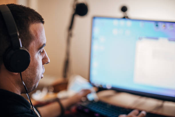 istock Male gamer playing video games on computer 1287655920