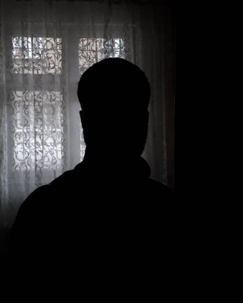 istock Man silhouette in front of the window 1287655928
