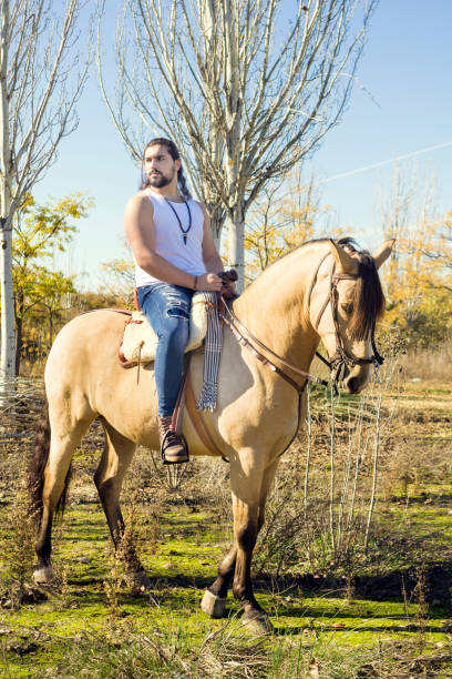 istock young man whit his horse 1287657653