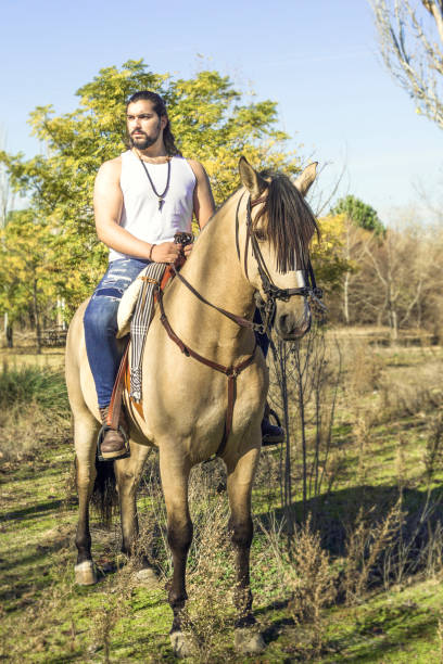 istock young man whit his horse 1287657725
