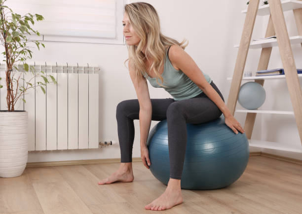 Pilates workout for women, physiotherapy. Female workout with fitness ball, balance and breathing exercises Pilates workout for women, physiotherapy. Female workout with fitness ball, balance and breathing exercises Pelvis stock pictures, royalty-free photos & images