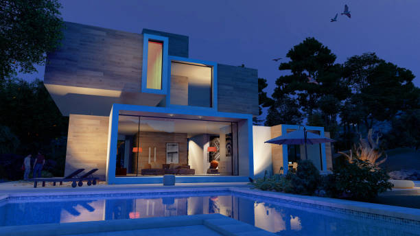 istock Modern  cubic house with pool by night 1287660528