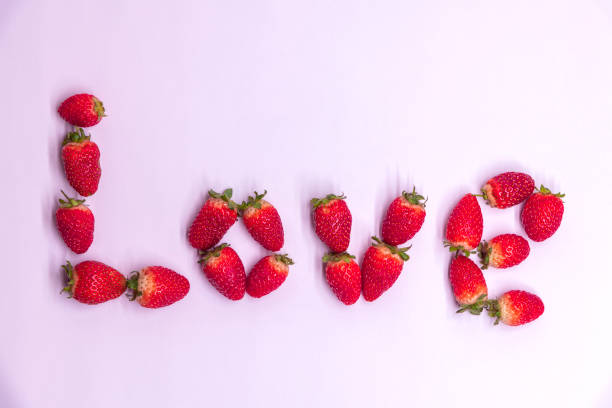 istock Love word made from strawberries 1287660533