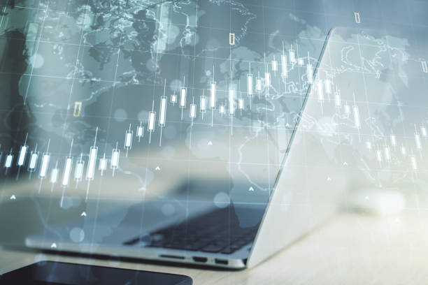 istock Double exposure of abstract creative financial chart with world map on laptop background, research and strategy concept 1287662208