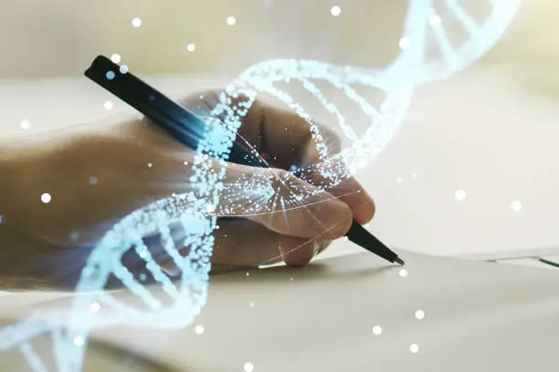 Photo of Creative light DNA illustration and man hand writing in diary on background, science and biology concept. Multiexposure