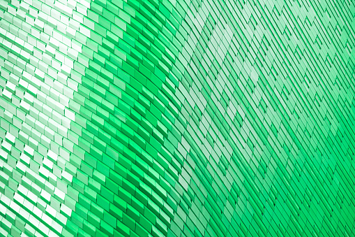 metal and glass modern background or wall of architecture design with green light. abstract structure of spaceship wall interior and exterior or modern building.