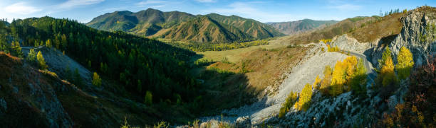 istock Mountains and hills altai in autumn, panoramic photo. 1287664940