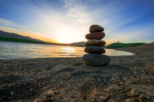 Tranquil view of  rocks near the lake in Alps