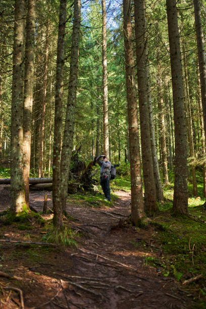 istock Professional nature photographer hiking 1287667555