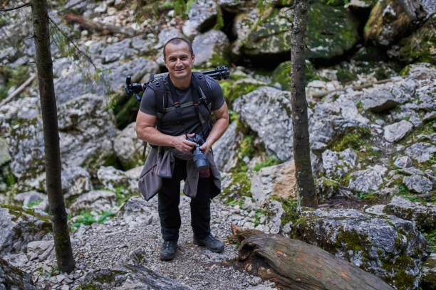 istock Professional nature photographer hiking 1287667572