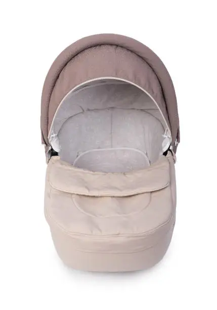 Beige carrycot stroller isolated over white background