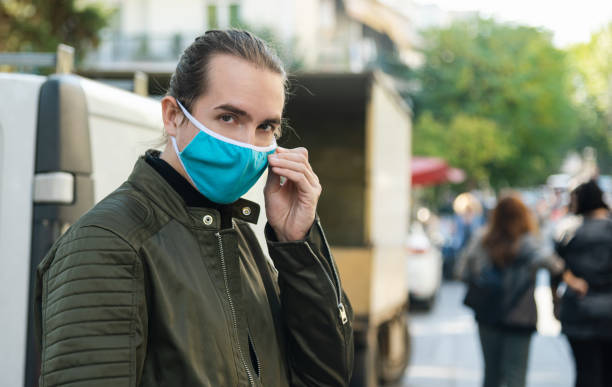 istock Portrait of man with reusable face mask. 1287668889