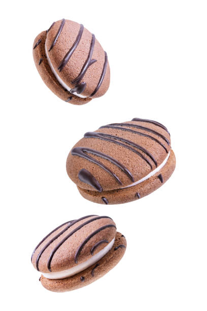 istock Soft chocolate cookies with marshmallow filling on a white isolated background 1287669075
